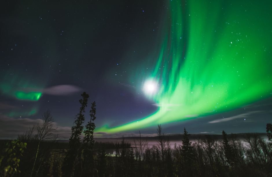 Coronal hole wind lights up Fairbanks aurora through bright moonlight
