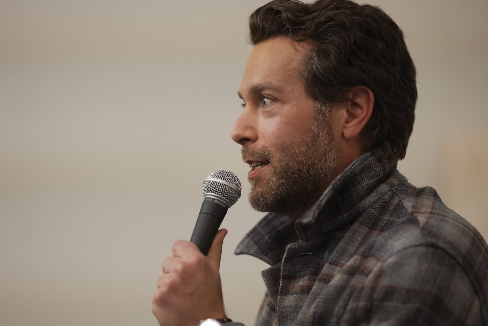 Man speaking into a microphone